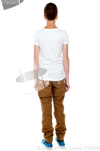 Image of Rear view portrait of casual young boy