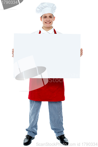 Image of Chef holding blank advertising board