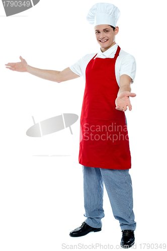 Image of Portrait of a male chef in red uniform
