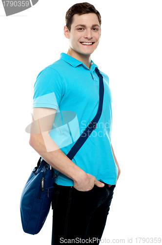 Image of Teenage guy carrying laptop bag