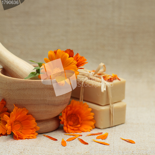 Image of Alternative medicine background with calendula flowers and bath 