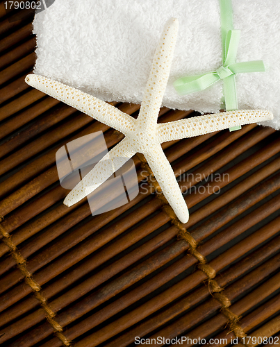 Image of Beauty Treatment - White Star on Bamboo Background