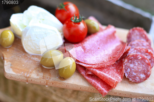 Image of Italian cuisine. Gourmet food - salami, olives, mozzarella