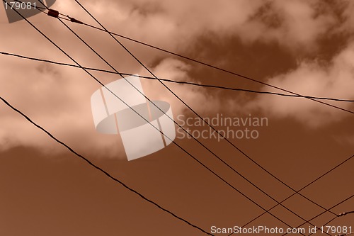 Image of powerlines with clouds monotone