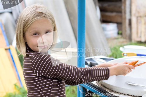 Image of Teen girl doing housework