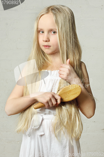 Image of Girl combing hair