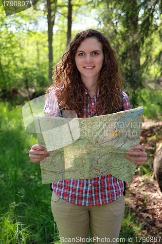 Image of Hiker is reading a map