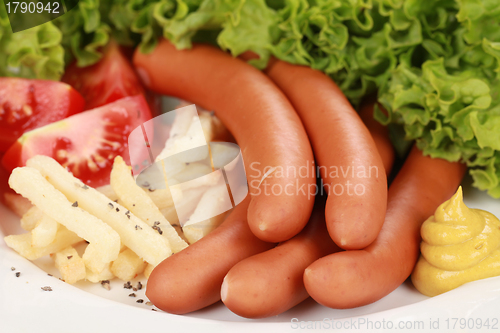 Image of Sausages and french fries