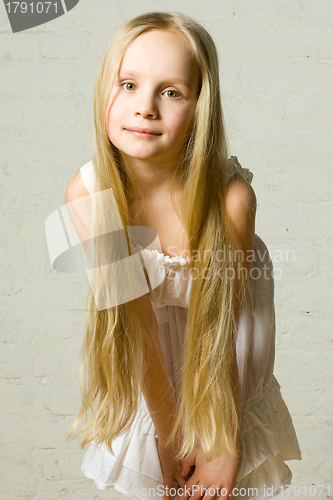 Image of Smiling child girl with long blond hair - portrait