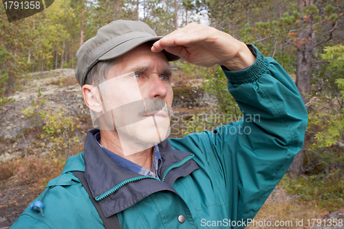 Image of An elderly traveller looking into the distance