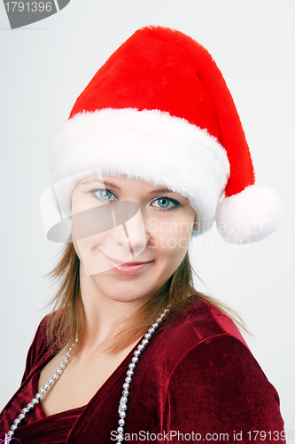 Image of attractive young woman a Christmas hat