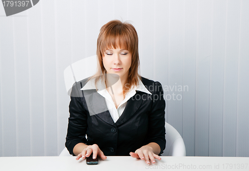 Image of attractive business woman meditating