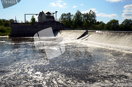 Image of Dirty barmy river water flow weir dam barrage 