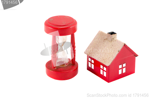 Image of house imitation broken sandglass isolated on white 