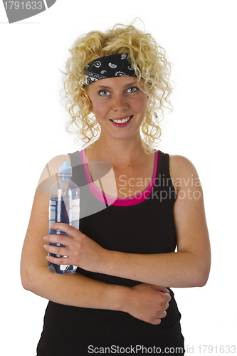 Image of Beautiful blond woman holding bottle of water 