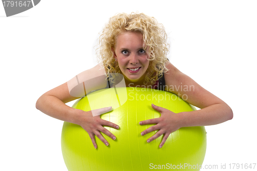 Image of Beautiful young woman with gym ball