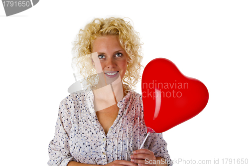 Image of Young woman with red heart ballon