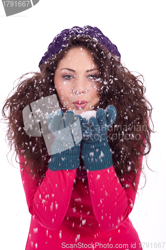 Image of beautiful smiling brunette woman in snow in winter 