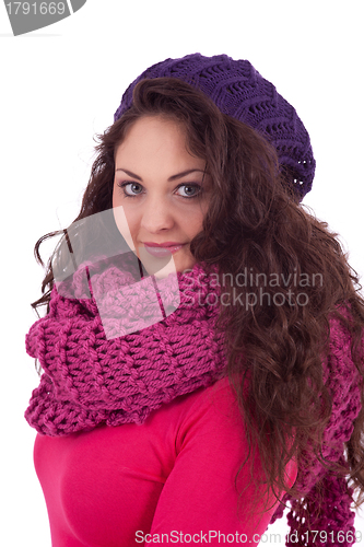 Image of beautiful young smiling girl with hat and scarf in winter