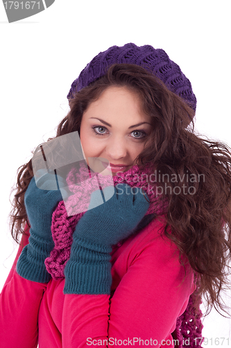 Image of beautiful young smiling girl with hat and scarf in winter