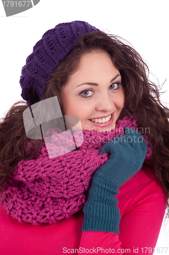 Image of beautiful young smiling girl with hat and scarf in winter