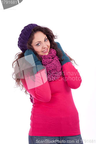 Image of beautiful young smiling girl with hat and scarf in winter