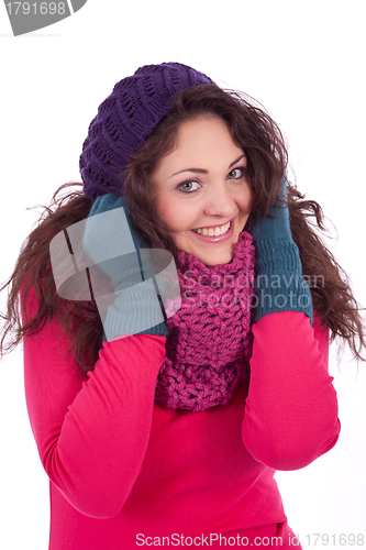 Image of beautiful young smiling girl with hat and scarf in winter