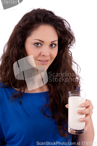 Image of beautiful smiling woman is drinking milk