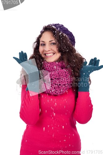 Image of beautiful smiling brunette woman in snow in winter 