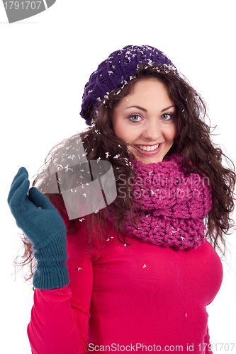 Image of beautiful smiling brunette woman in snow in winter 