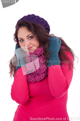 Image of beautiful young smiling girl with hat and scarf in winter