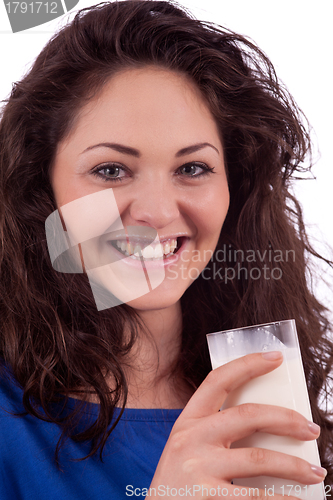 Image of beautiful smiling woman is drinking milk