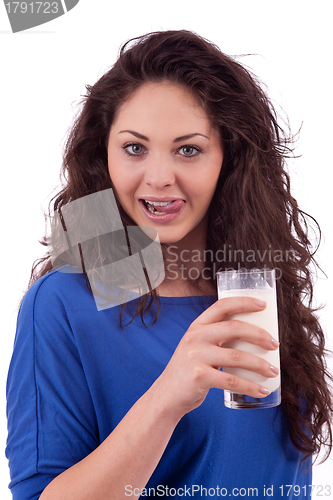 Image of beautiful smiling woman is drinking milk