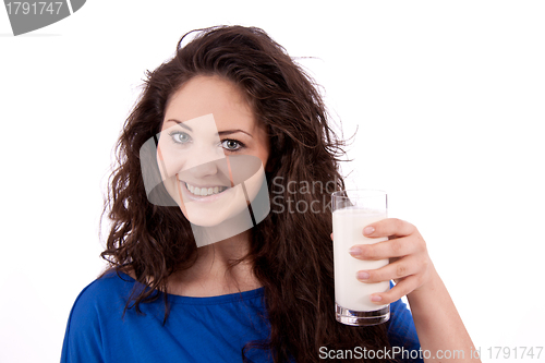 Image of beautiful smiling woman is drinking milk