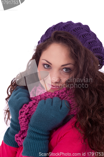 Image of beautiful young smiling girl with hat and scarf in winter