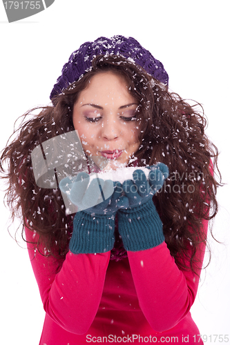 Image of beautiful smiling brunette woman in snow in winter 