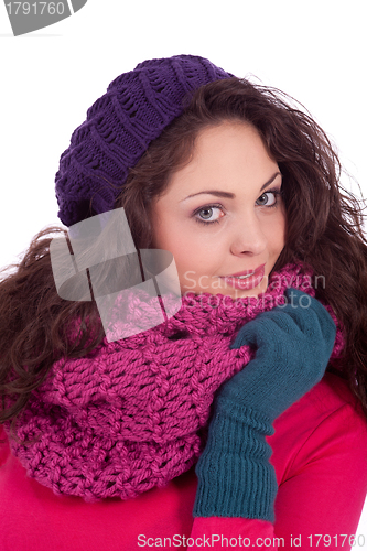 Image of beautiful young smiling girl with hat and scarf in winter