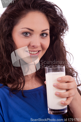 Image of beautiful smiling woman is drinking milk
