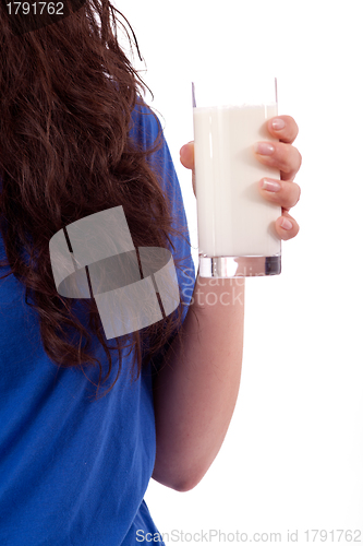 Image of beautiful smiling woman is drinking milk