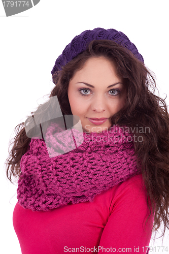 Image of beautiful young smiling girl with hat and scarf in winter