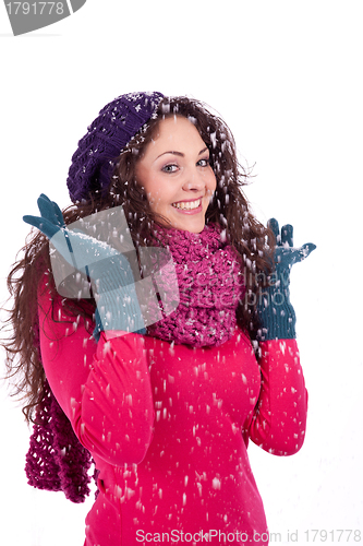 Image of beautiful smiling brunette woman in snow in winter 