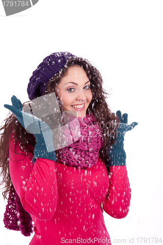 Image of beautiful smiling brunette woman in snow in winter 