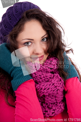 Image of beautiful young smiling girl with hat and scarf in winter