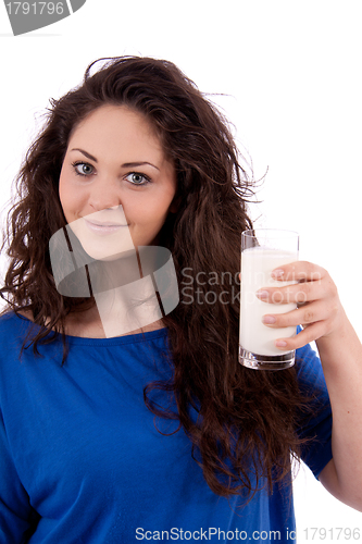 Image of beautiful smiling woman is drinking milk