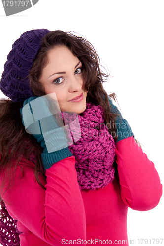 Image of beautiful young smiling girl with hat and scarf in winter