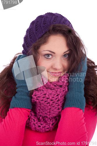 Image of beautiful young smiling girl with hat and scarf in winter