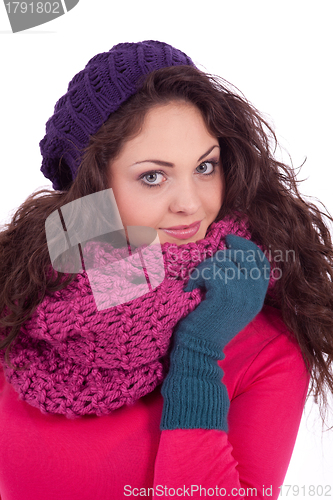 Image of beautiful young smiling girl with hat and scarf in winter