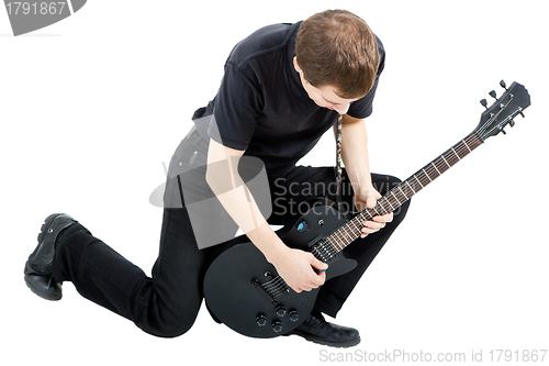 Image of performer with an electric guitar