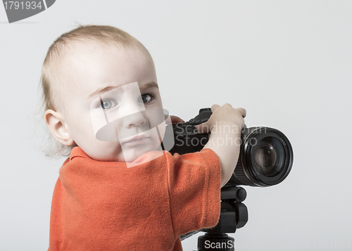 Image of young child with digital camera