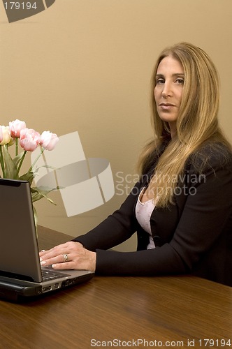 Image of pretty woman at desk